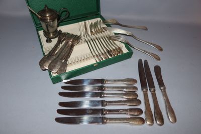 a green case with silverware in it on a table