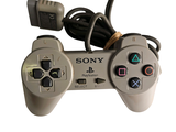 a video game controller that is connected to a charger