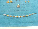 a picture of a necklace and earring set on a table