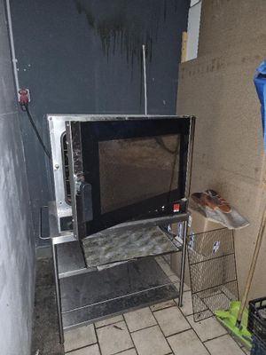 a microwave that is sitting in the corner of a room