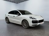 the porsche cayense suv is parked in a white room