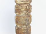 sculpture of a totema made of stone on a white background