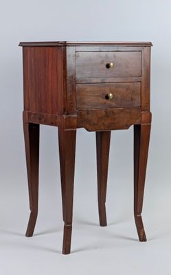 a small wooden table with a drawer on it