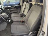 the interior of a car with the door open and the driver ' s seat down