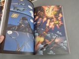 someone is holding a comic book open to a page with a picture of a fighter