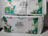 two bags of toilet paper sitting on top of each other