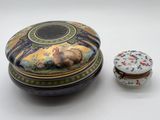 a small box with a lid and a small box with a picture on it