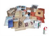 a pile of old books on a white surface