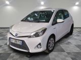 a picture of a white toyota yaris parked in a showroom