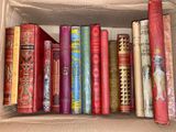 a box full of books that are sitting on a shelf