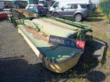 a large green machine that is parked in the parking lot