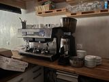 a coffee machine sitting on a counter in a kitchen