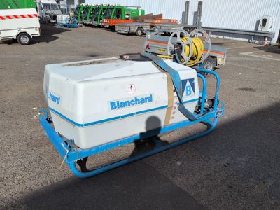 a picture of a blue and white machine in a parking lot