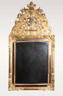 an ornate gold framed mirror with a blackboard in the middle