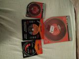 three dvds on the bed next to each other