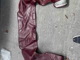 a pair of boots and a pair of shoes on the ground