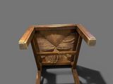 an image of a wooden chair with carvings on the seat
