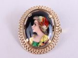 an image of a picture of a woman wearing a crown on a broocher