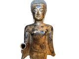 an image of a statue of a buddha holding a pipe