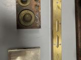 three different types of door knobs on the wall