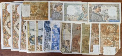a lot of different bank notes on the table