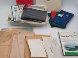 many papers, books, and other items on the table