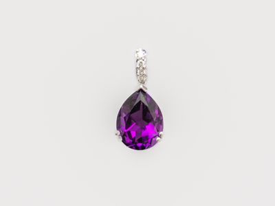 an amethorate and diamond pendant on a white background