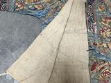 a piece of cloth on the ground next to a piece of cloth