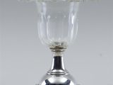 silver plated wine glass with raised stem and raised base