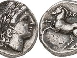 a silver coin with a horse on the front and a horse on the back