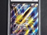 a close up of a pokemon card on a black surface