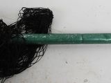 an image of a green broom with a net on it