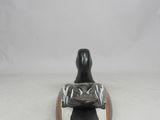 an image of a figurine of a woman sitting on top of a duck