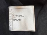 a label on a black jacket with a white and black design