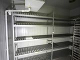 a room with shelves and racks in it that are empty