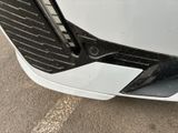 a close up of a car ' s front bumper