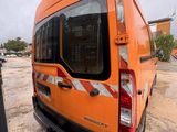 an orange van that is parked in a lot