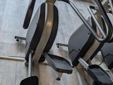 a stationary exercise machine in a gym room