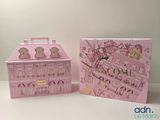 a pink box with a picture of a building inside of it