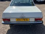 a silver car that is parked in a parking lot