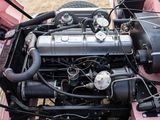 a small engine in the back of a pink car