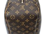 a close up of a louis vuitton handbag on a white surface