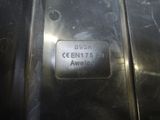a close up of a metal plate with a name on it