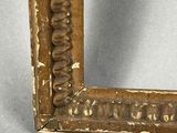 an old picture frame with a decorative pattern on it