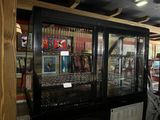a glass display case with a lot of items inside of it