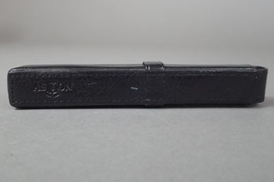 a black case sitting on a table with a white background