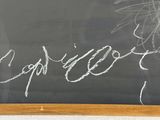 a chalk board with writing on it with a picture on it
