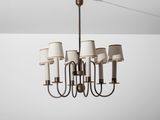 a chandelier with six lamps and a white shade