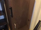 an image of a refrigerator in the corner of a room