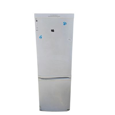 a white refrigerator freezer sitting on top of a white counter